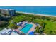 Aerial view of resort pool and beach access at 1065 Gulf Of Mexico Dr # 201, Longboat Key, FL 34228