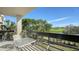 Condo balcony overlooking a lush green golf course and pond at 1065 Gulf Of Mexico Dr # 201, Longboat Key, FL 34228