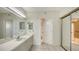 Clean bathroom, vanity with sink and shower at 1065 Gulf Of Mexico Dr # 201, Longboat Key, FL 34228