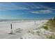 Relax on the beach with lounge chairs and umbrellas at 1065 Gulf Of Mexico Dr # 201, Longboat Key, FL 34228