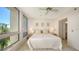 Bright bedroom with large window and comfortable bed at 1065 Gulf Of Mexico Dr # 201, Longboat Key, FL 34228