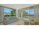 Bright living room with ample natural light and golf course view at 1065 Gulf Of Mexico Dr # 201, Longboat Key, FL 34228