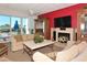 Spacious living room with fireplace and large TV at 1065 Gulf Of Mexico Dr # 201, Longboat Key, FL 34228