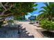 Relaxing pool area with lounge chairs at 1065 Gulf Of Mexico Dr # 201, Longboat Key, FL 34228