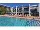 Resort-style pool with lounge chairs at 1065 Gulf Of Mexico Dr # 201, Longboat Key, FL 34228