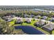 Community overview with lakefront properties and lush greenery at 11907 Petunia Ter, Bradenton, FL 34212
