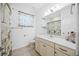 Clean bathroom with a vanity, toilet and shower/tub combo at 11907 Petunia Ter, Bradenton, FL 34212