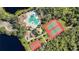 Aerial view of community amenities including pool, tennis and basketball courts at 11907 Petunia Ter, Bradenton, FL 34212