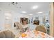 Gathering room with a projector, comfortable seating, and built-in shelving at 11907 Petunia Ter, Bradenton, FL 34212