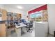 Spacious home office with large desk, built-in shelves, and pond view at 11907 Petunia Ter, Bradenton, FL 34212