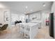 Open concept kitchen with large island and breakfast bar at 11907 Petunia Ter, Bradenton, FL 34212