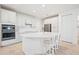 Spacious kitchen featuring white cabinets, large island, and stainless steel appliances at 11907 Petunia Ter, Bradenton, FL 34212