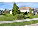 Landscaped side yard with a spacious lawn at 11907 Petunia Ter, Bradenton, FL 34212