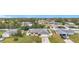 House with gray roof, attached garage, and large backyard at 161 Sandhurst Dr, Venice, FL 34293