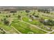 Aerial view of a lush green golf course at 161 Sandhurst Dr, Venice, FL 34293