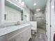 Updated bathroom with marble vanity, large shower, and pebble floor at 161 Sandhurst Dr, Venice, FL 34293