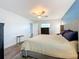 Bright bedroom with ceiling fan, large bed, and wood-look floors at 161 Sandhurst Dr, Venice, FL 34293