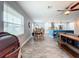 Bright dining area with wooden table and chairs, open to the kitchen at 161 Sandhurst Dr, Venice, FL 34293