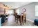 Bright dining area with wood table and chairs at 161 Sandhurst Dr, Venice, FL 34293