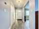 Clean and spacious hallway with wood-look tile flooring at 161 Sandhurst Dr, Venice, FL 34293