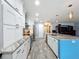Modern kitchen with white cabinets and granite countertops at 161 Sandhurst Dr, Venice, FL 34293
