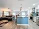 Open concept kitchen and living area with modern finishes at 161 Sandhurst Dr, Venice, FL 34293