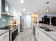 Modern kitchen with island and stainless steel appliances at 161 Sandhurst Dr, Venice, FL 34293