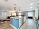 Open concept kitchen and living area with modern finishes at 161 Sandhurst Dr, Venice, FL 34293