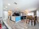 Open concept kitchen with island and living room view at 161 Sandhurst Dr, Venice, FL 34293