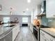 Modern kitchen with stainless steel appliances and granite countertops at 161 Sandhurst Dr, Venice, FL 34293