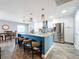 Modern kitchen with stainless steel appliances and a large island at 161 Sandhurst Dr, Venice, FL 34293