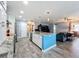 Open concept kitchen with island and living room view at 161 Sandhurst Dr, Venice, FL 34293