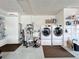 Convenient laundry room with washer, dryer, and extra storage at 161 Sandhurst Dr, Venice, FL 34293