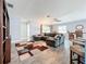 Open living space with sectional sofa, dining area and kitchen views at 161 Sandhurst Dr, Venice, FL 34293
