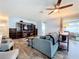 Living room with sectional sofa, built-in shelving and TV at 161 Sandhurst Dr, Venice, FL 34293