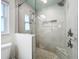 Large walk-in shower with pebble floor and glass door at 161 Sandhurst Dr, Venice, FL 34293