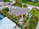 Aerial view of house with lush landscaping and RV at 1854 Cockleshell Dr, Sarasota, FL 34231