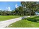 Peaceful park-like setting with grassy area and trees at 1854 Cockleshell Dr, Sarasota, FL 34231