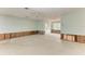 Large living room with access to kitchen. Currently undergoing renovation at 219 Periwinkle Plz, Anna Maria, FL 34216