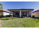 House with a screened in patio and well maintained backyard at 2479 Brassica Dr, North Port, FL 34289