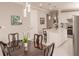 Elegant dining room with dark wood table and chairs near kitchen at 2479 Brassica Dr, North Port, FL 34289
