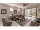 Spacious living area with sliding glass doors, plush seating, and a relaxing atmosphere at 2479 Brassica Dr, North Port, FL 34289