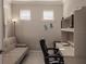 Home office features a comfortable sofa bed, built-in shelving, and a workspace at 2479 Brassica Dr, North Port, FL 34289