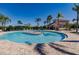 Relax by the circular pool with plenty of lounge chairs at 2479 Brassica Dr, North Port, FL 34289