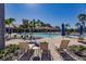 Enjoy the resort-style pool with lounge chairs and umbrellas at 2479 Brassica Dr, North Port, FL 34289
