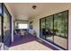 Screened patio with brick flooring and outdoor furniture at 2479 Brassica Dr, North Port, FL 34289