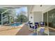 Relaxing pool area with covered patio and seating at 2538 Marblehead Dr, Sarasota, FL 34231