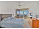 Comfortable bedroom with king-size bed and access to balcony at 3060 Grand Bay Blvd # 162, Longboat Key, FL 34228