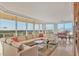 L-shaped sectional sofa and large windows with water views at 3060 Grand Bay Blvd # 162, Longboat Key, FL 34228