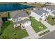 Birds-eye view of a house with a lake in the background at 341 Grande Vista Blvd, Bradenton, FL 34212